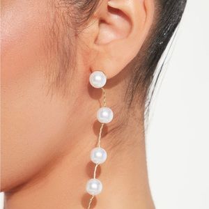 Falling white pearl earrings